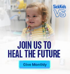 An infant wearing Bravery Beads and smiling. Join us to health the future. Give monthly.